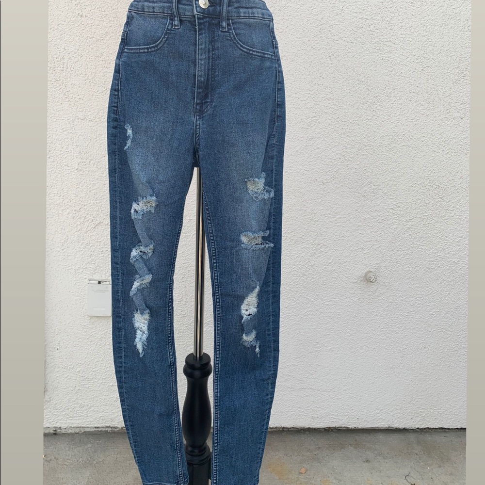 High waisted dark blue jeans.